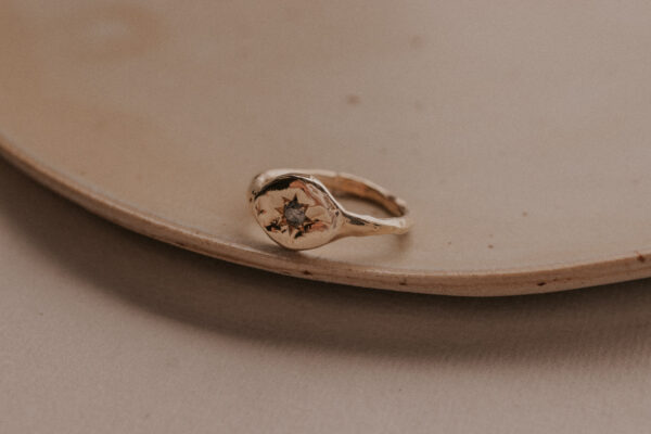 Signet ring with diamond in star setting