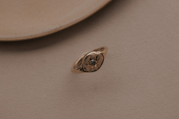 Signet ring with diamond in star setting