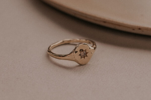 Signet ring with diamond in star setting