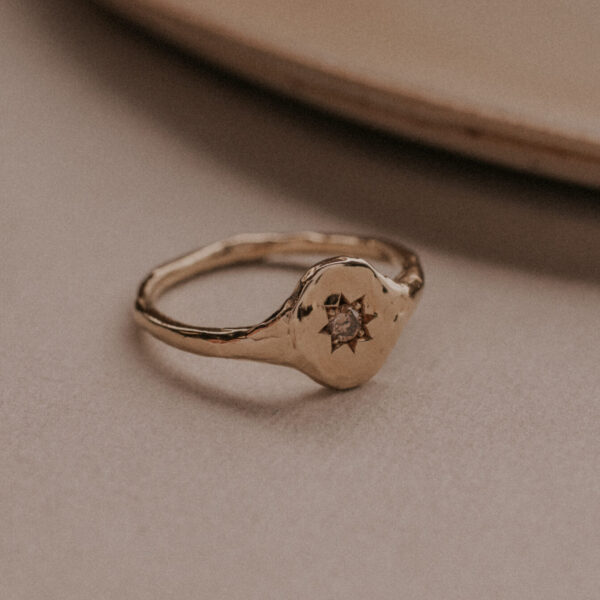 Signet ring with diamond in star setting