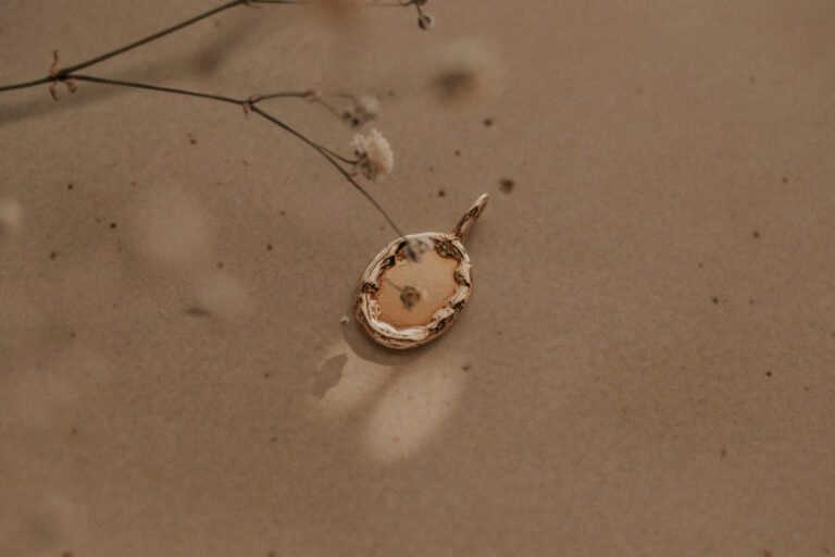 Gold mirror-like charm for necklaces