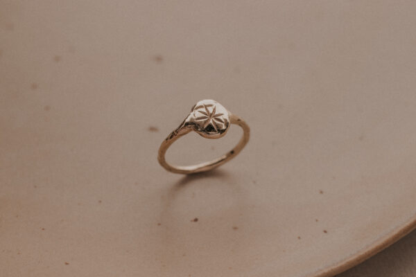 Signet ring with engraved star in the middle
