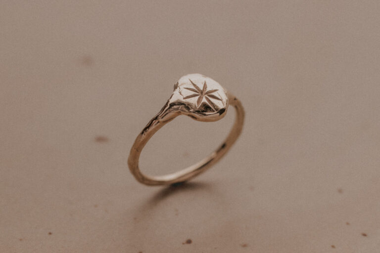 Signet ring with engraved star in the middle