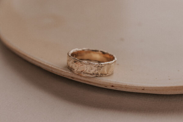 Gold ring with structure resembling the sand dunes