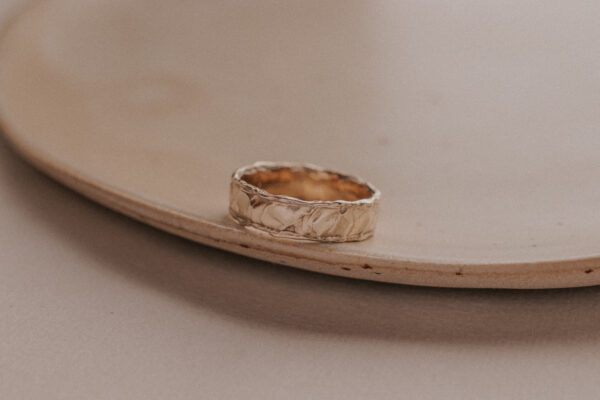 Gold ring with structure resembling the sand dunes