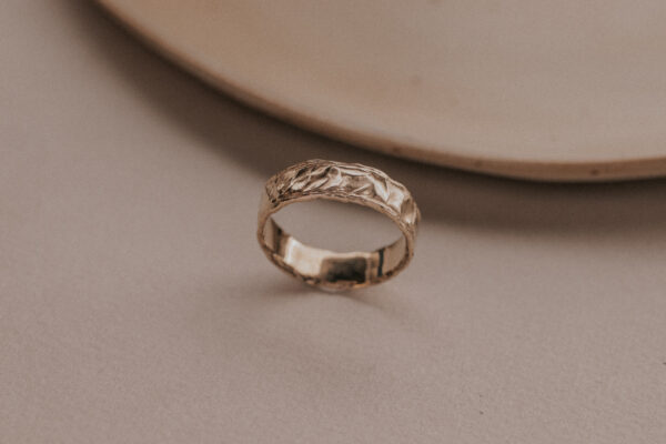 Gold ring with structure resembling the sand dunes