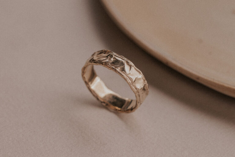 Gold ring with structure resembling the sand dunes
