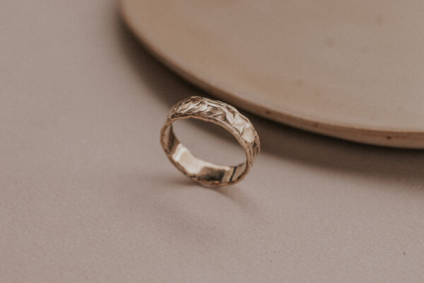 Gold ring with structure resembling the sand dunes