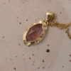 14k gold molten strawberry quartz charm
