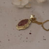 14k gold molten strawberry quartz charm